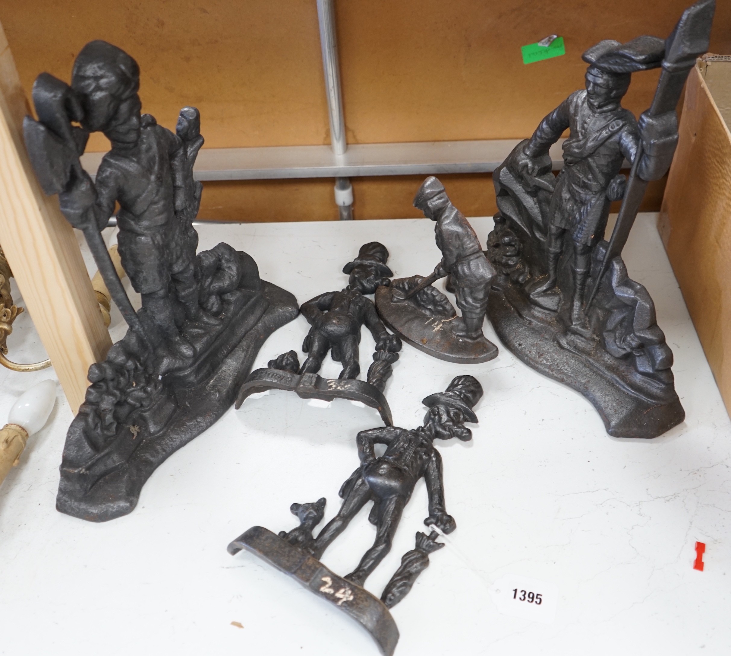 Five assorted Victorian figural cast iron doorstops